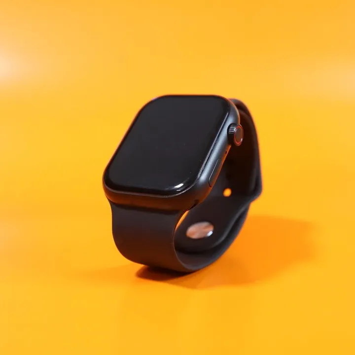 Black smartwatch on an orange background used to illustrate a product card